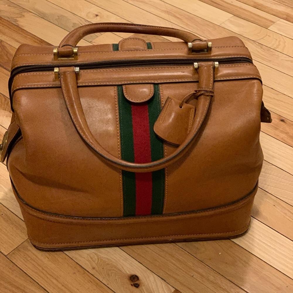 GUCCI weekender, cosmetic train case.